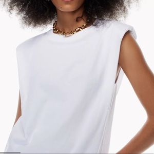 White shoulder pad tank by Babaton. Size XS. Like new, Never been worn.